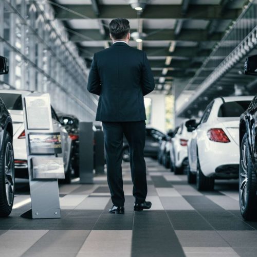 Top sales manager at dealership showroom