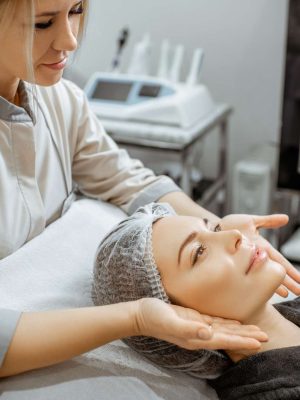 Woman during the facial massage at the beaty salon